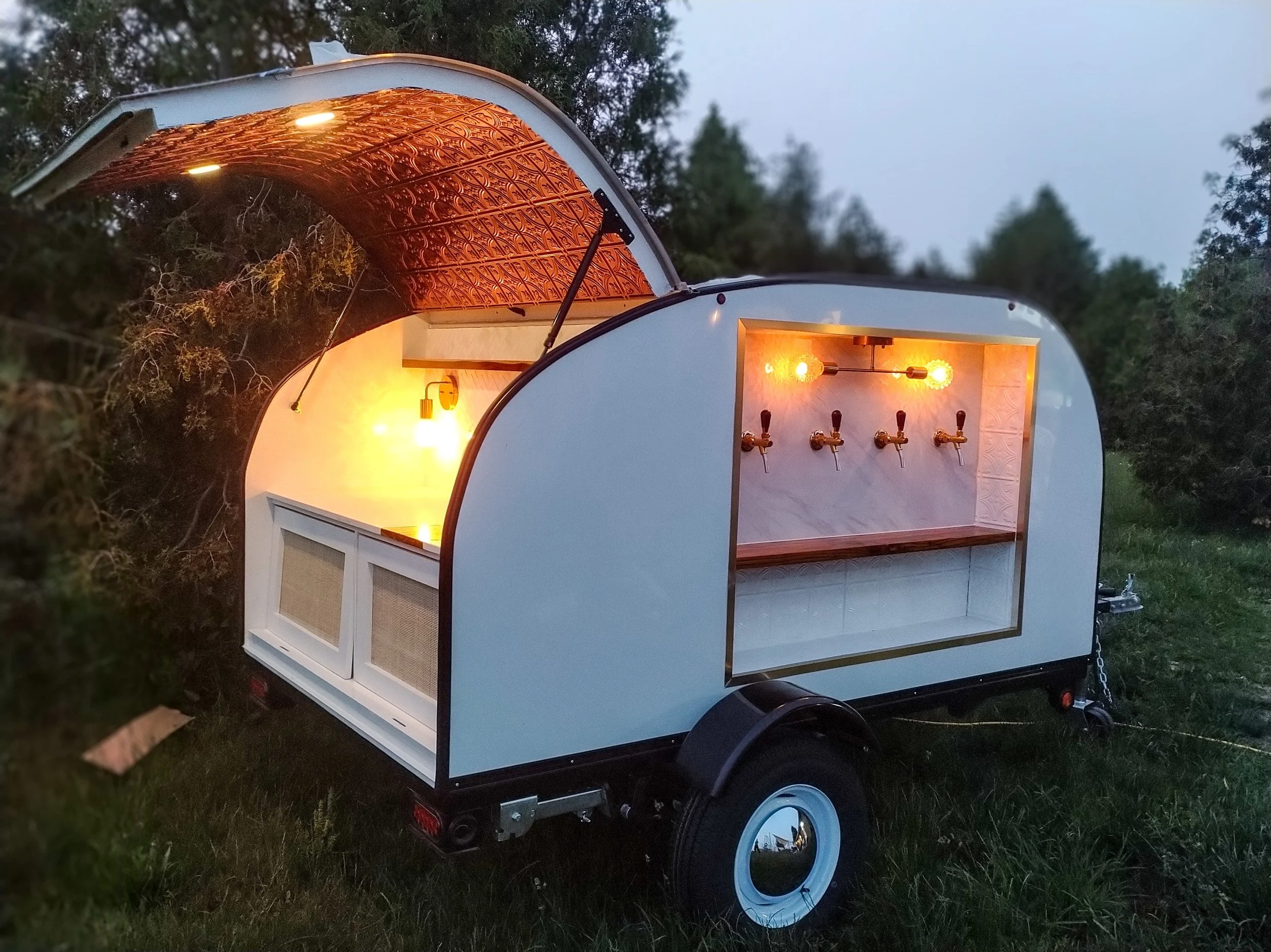 Elegant mobile bar trailer at twilight